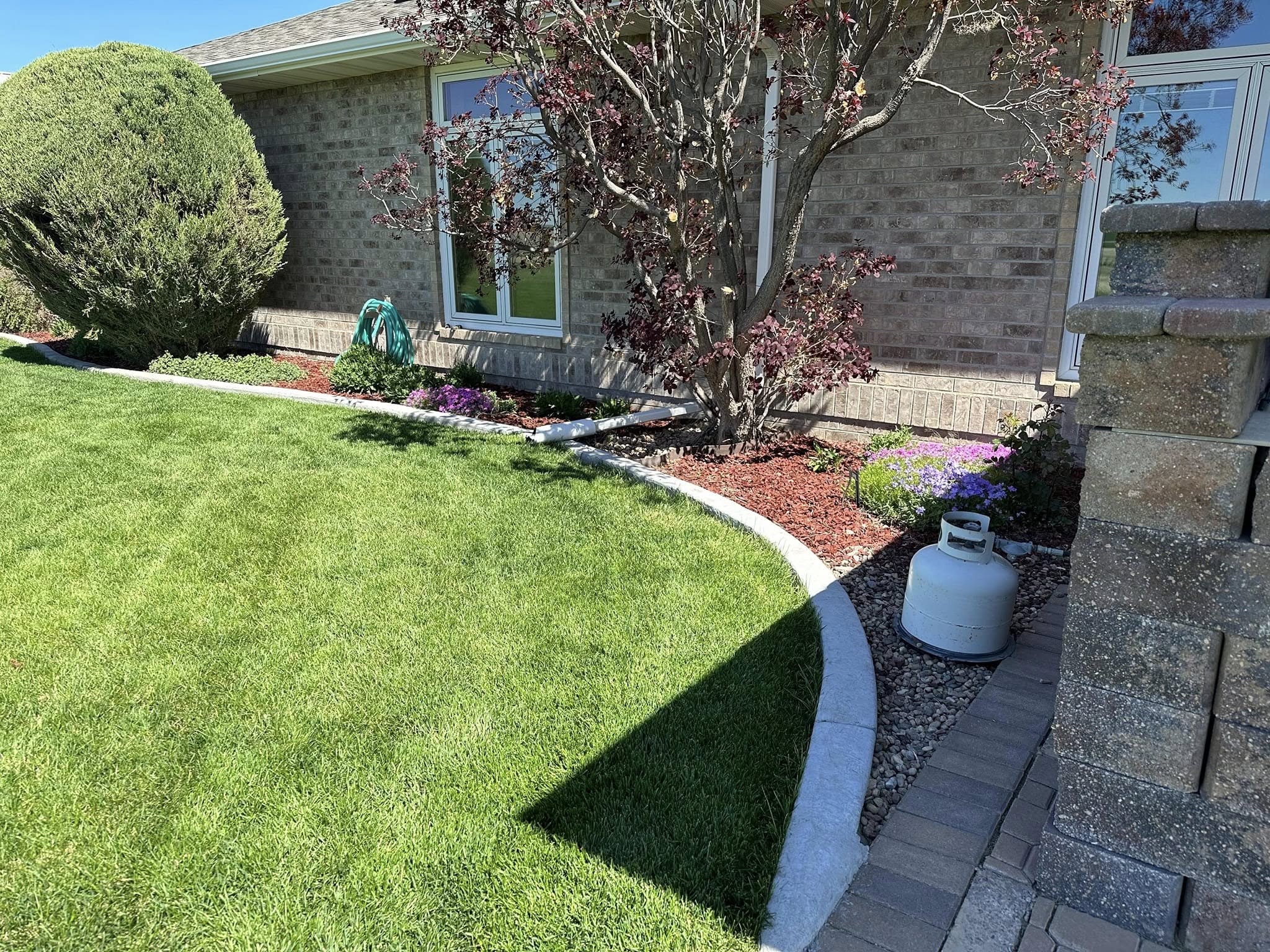 Foundation landscaping with curved edging