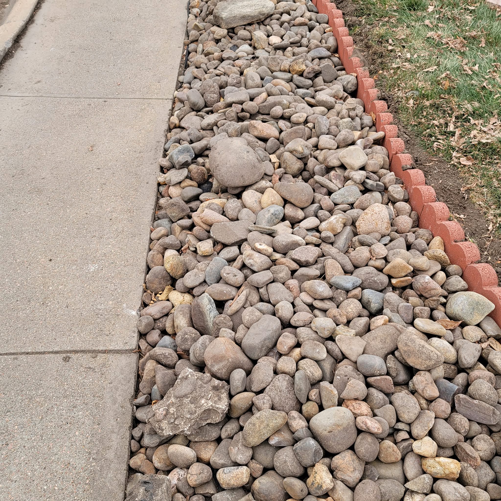 River rock bed with brick border