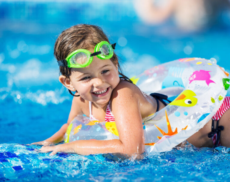 Happy swimmer enjoying clean pool