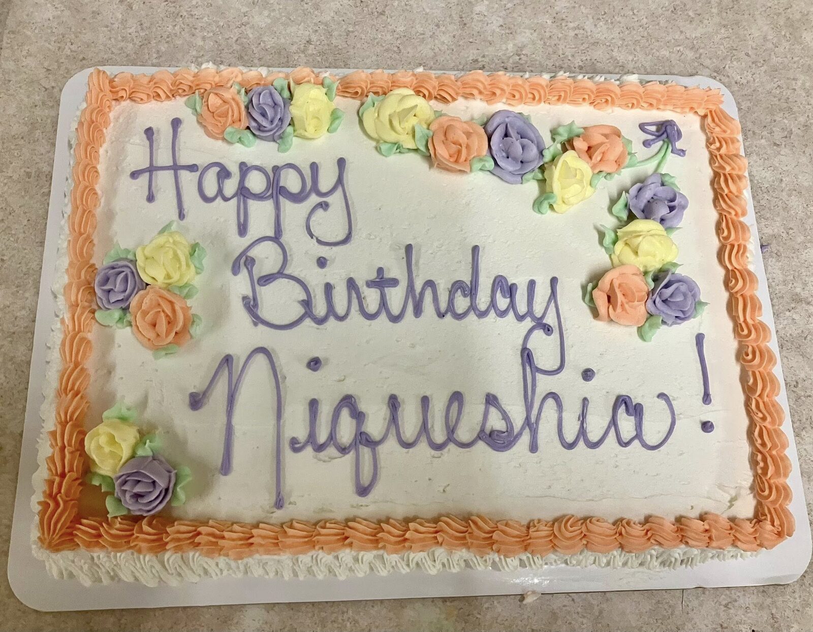 Birthday sheet cake with colorful piped flowers