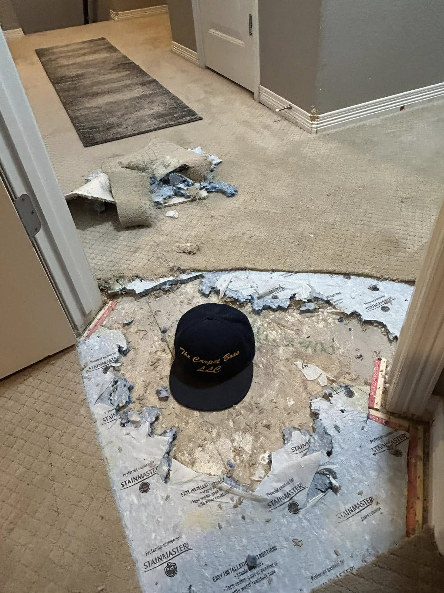 Flooring installation in progress with substrate prep and tools
