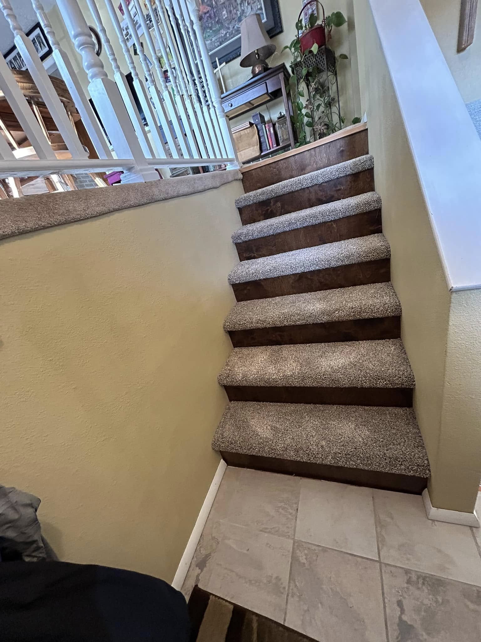 Staircase with tan and brown carpet installation