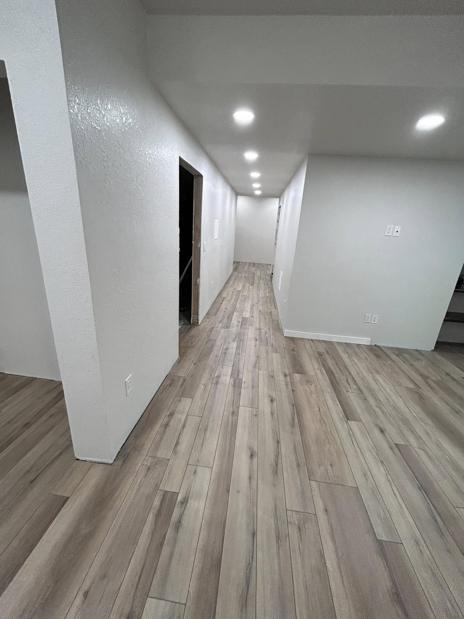 Hallway with light wood-tone plank flooring